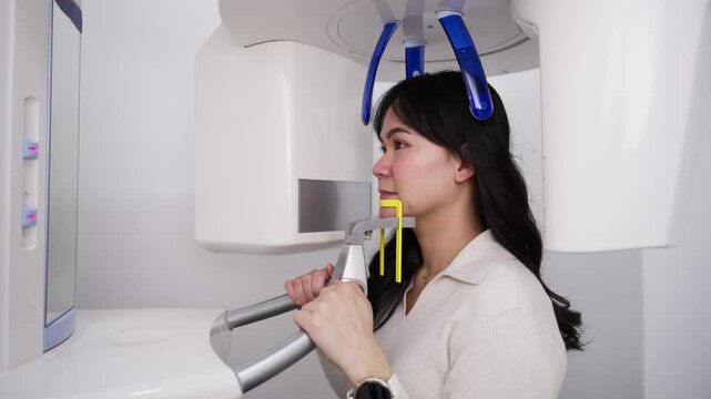 Asian woman receiving dental panoramic x ray
