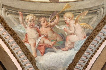 Obraz premium CREMA, ITALY - MARCH 20, 2026: The fresco of baroque angels with the symbols of David the church Santuario di Santa Maria della Croce by brothers Giuseppe and Giovanni Antonio Torricell from year 1762