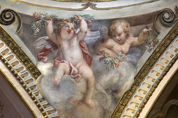 Obraz premium CREMA, ITALY - MARCH 20, 2026: The fresco of angels with the flowers the church Santuario di Santa Maria della Croce by Giacomo Parravicino - il Gianolo (1702).
