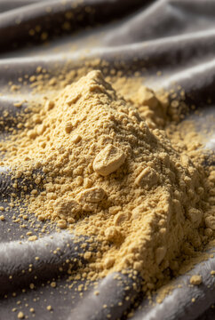 Extreme macro of kinako powder dusting over velvet surface,