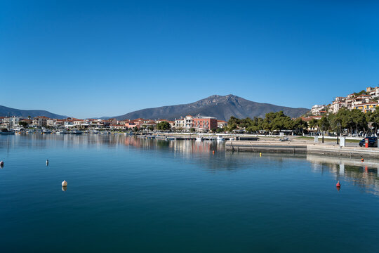 Peloponnese, Paralio Astros port, Arcadia Greece. View of traditional building, moored boat in harbor,