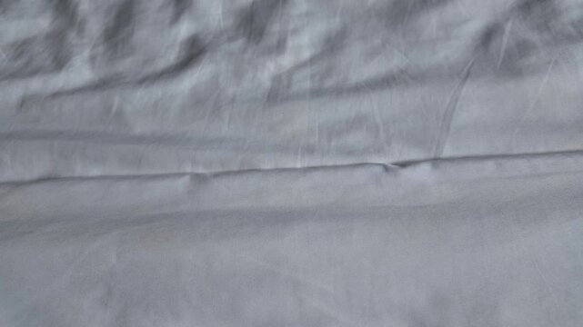 Elegant Light Gray Fabric Smooth Texture with Soft Folds and Subtle Wrinkles for Timeless Textile Design