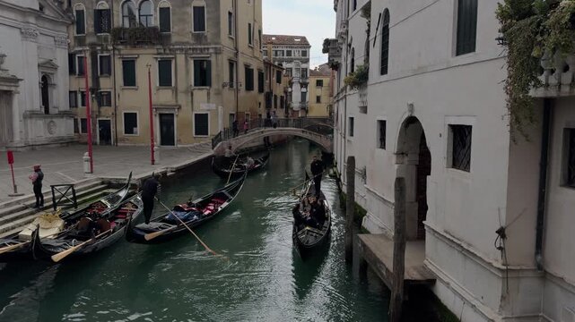 Gondolier Leaving Shore on Quiet Venice Canal Morning