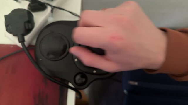 Hand switching gear shifter on racing simulator wheel set, gaming transmission controller and computer driving concept