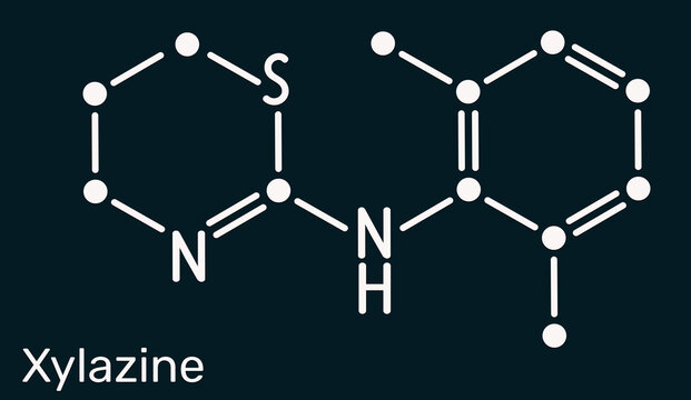 Xylazine molecule. Veterinary drug used for sedation, anesthesia, muscle relaxation, and analgesia in animals. Dark blue background