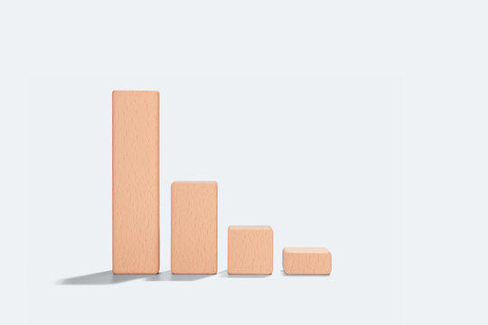 Business crisis concept with collapsing wooden block chart