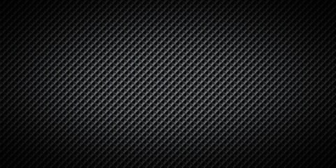 Black abstract carbon fiber texture background with repeating geometric square pattern and subtle spotlight illumination. © โยธิน ทุมจีน