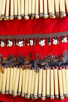 red textile, regalia trim, feather detail, traditional regalia, pueblo regalia, Native American culture, Indigenous culture, New Mexico pueblo, ceremonial attire, textile detail, traditional clothing,