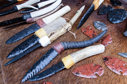 Traditional stone tools and arrowheads display close up