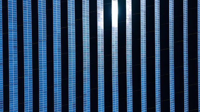 Long rows of modern solar panels. Technology and energy saving concept. Top view.