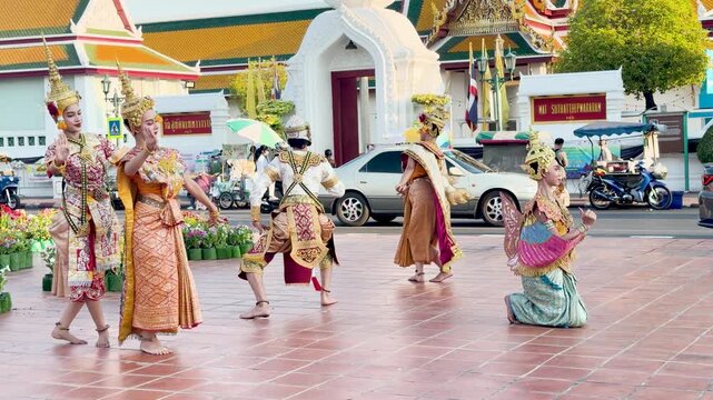 Traditional Thai Khon Dancers Perform in Front of Wat Suthat Temple