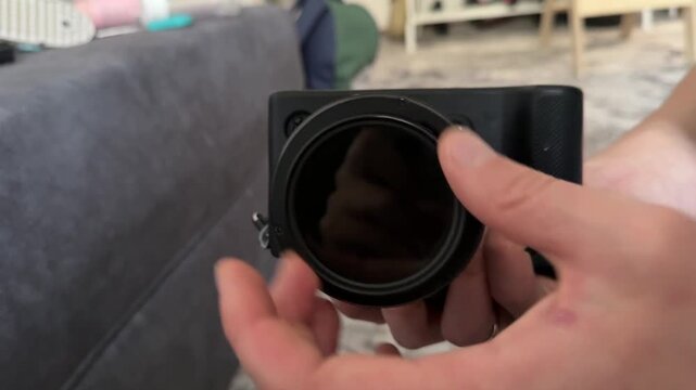 Hands installing lens on digital camera body, photography equipment setup and optical accessory concept