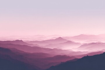 Obraz premium Serene pink sunrise over misty mountain range
