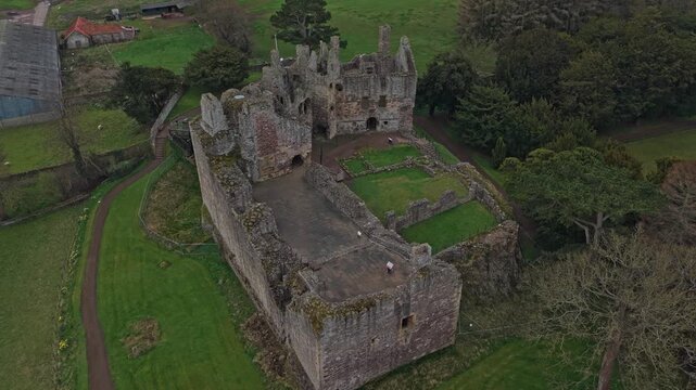 Aerial view of the historic dirleton castle, a medieval fortress ruin in east lothian, scotland, showcasing its ancient architecture
