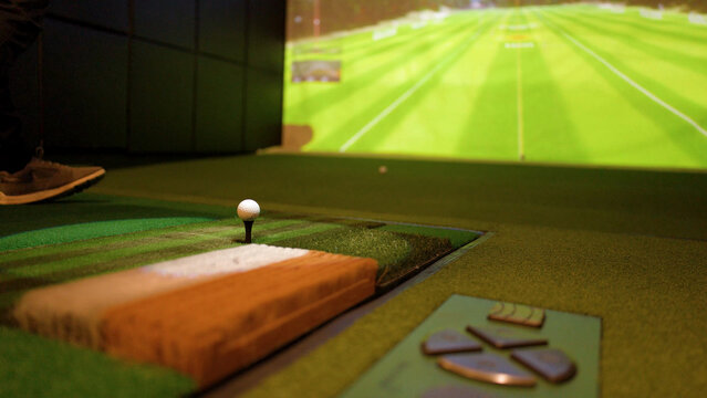Close Up of Golf Ball on Tee in Indoor Simulator