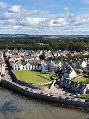 Fototapeta premium Aerial View of Coastal Village Houses and Seawall in Dundee Scotland