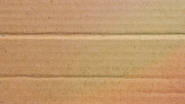 Natural Brown Cardboard Paper Texture Background With Horizontal Creases Close Up