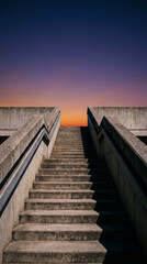 Fototapeta premium Concrete stairs leading up to bright sunset sky, success and progress abstract architecture concept.