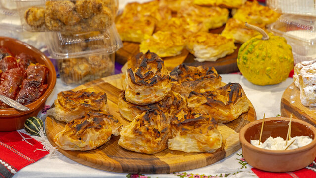 Baked Savory Crinkled Phyllo Pie Pastry at Wooden Tray Festive Food Table