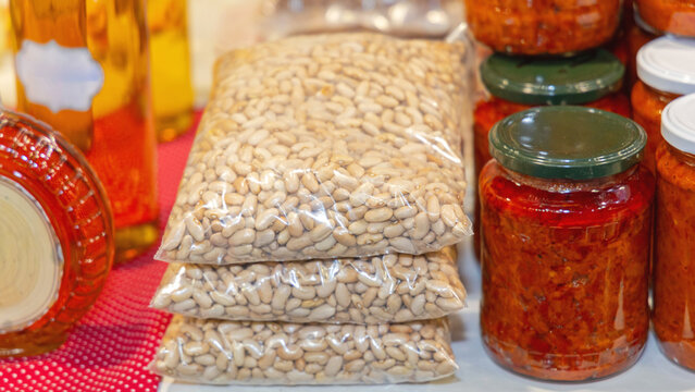 Stacked White Beans Legume in Bags at Food Market Stall