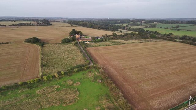 Aerial View of Harvested Farmland and Patchwork Fields in Northamptonshire English Countryside