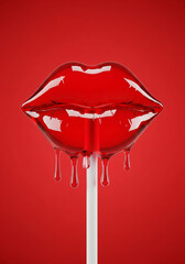Obraz premium Glossy red lip-shaped lollipop melting and dripping on a white stick against a vibrant red background.