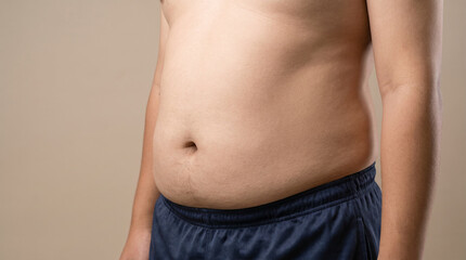 Naklejka premium Man with stomach discomfort, hands pressing on belly. Symbolizes bloating, indigestion, and abdominal pain in adults.