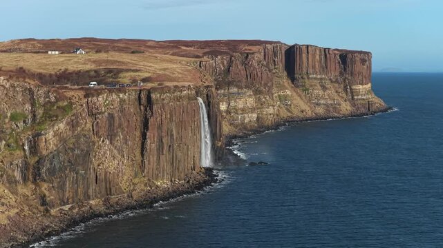 Stunning aerial view of the mealt falls waterfall at kilt rock on the trotternish peninsula, isle of skye, scotland during a sunny day