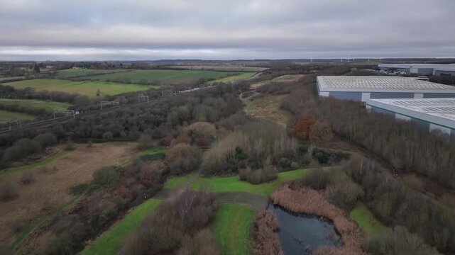 Aerial Drone View of Wetland Ponds and Industrial Warehouses Near Kettering Northamptonshire
