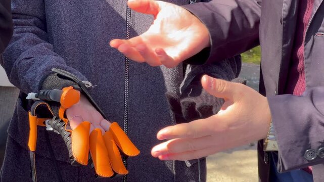 Person testing a robotic exoskeleton glove