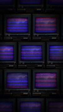 A looping background of stacked retro televisions with distorted glitch and interference noise.
