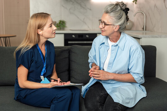 Doctor visits patient at home for health assessment and support