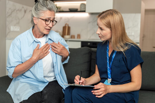 Doctor meets patient at home for check-up and discussion about health needs