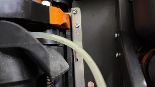 brewing unit rotating inside coffee vending machine, internal mechanism operating during drink preparation close up