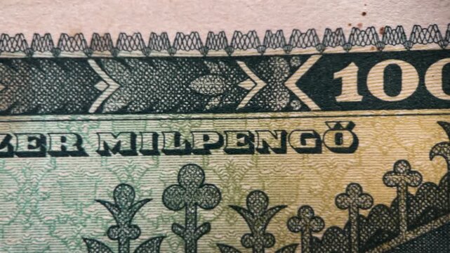 Closeup view of a 100 milpeng hungarian banknote, ideal for financial, currency, history, design, and moneyrelated concepts in business.