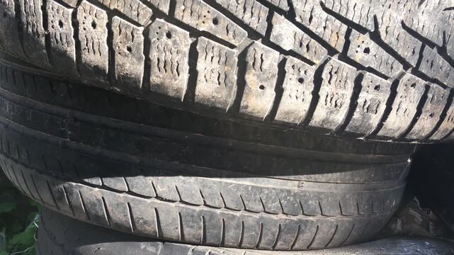 A landfill has accumulated a large number of car tires.