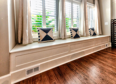 Window seat with cushions and windows