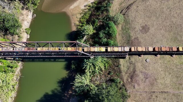 Aerial downward video of a freight train travelling through rural countryside in New South Wales Australia.