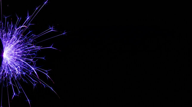 High voltage electrical arc filaments and violet light sparks concentrated on the far left border of a matte black studio background with empty copy space