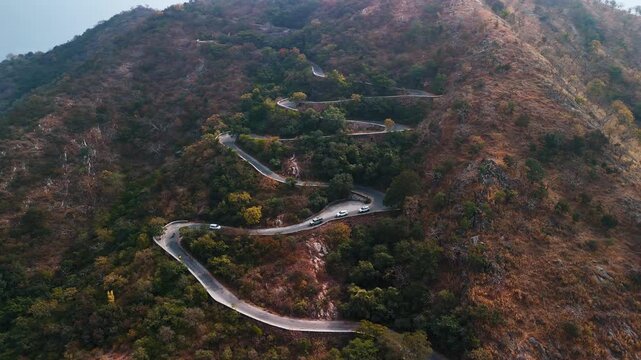 Zig Zag Mountain Roads Through Scenic Green Hills and Nature Landscape