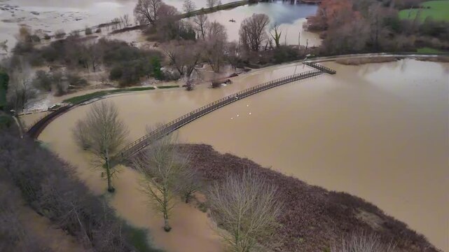 Aerial View of Flooded Park Walkway with Industrial Buildings in Background Kettering Northamptonshire