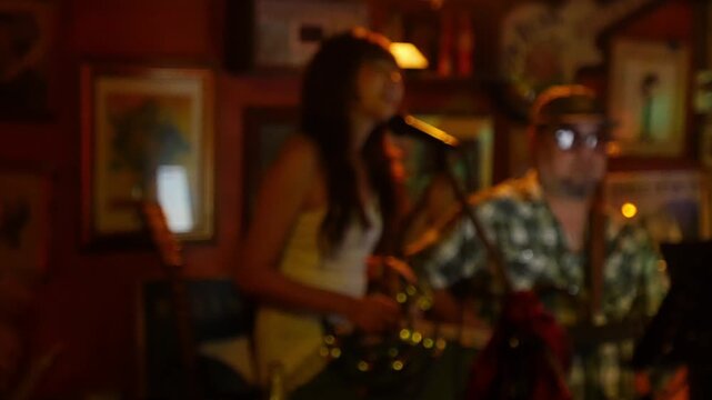 Blurred defocused live music jazz band performance inside cozy vintage bar with warm golden red bokeh ambiance nightlife