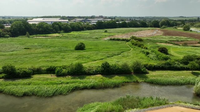 Aerial View of Pond and Wetland in South Meadow Nature Reserve with Industrial Estate Backdrop Barton Seagrave England