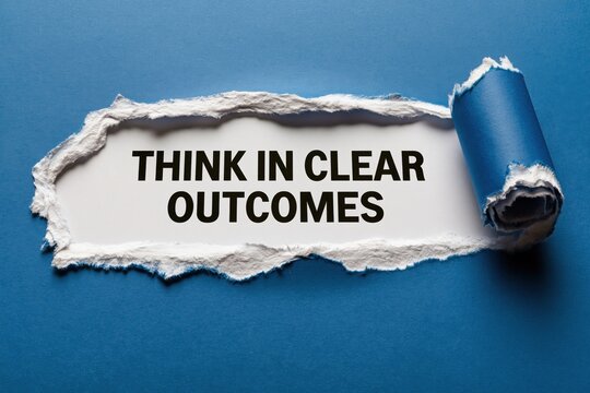 Think In Clear Outcomes goal-setting advice on a paper background