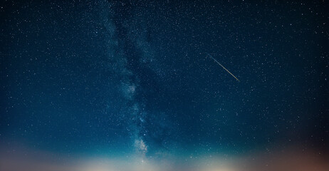 Fototapeta premium Constellations and Milky Way stars on a dark countryside skies.