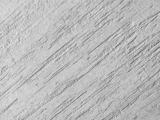Rough white textured background surface with diagonal scratches lines pattern giving calm and grounded feeling perfect for minimalist design projects and adding subtle depth to visual compositions © CoreRock