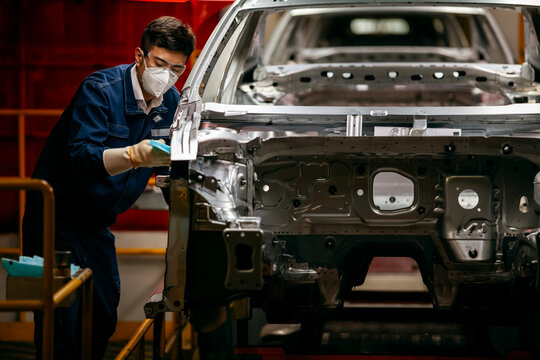   workers are building car production lines.
