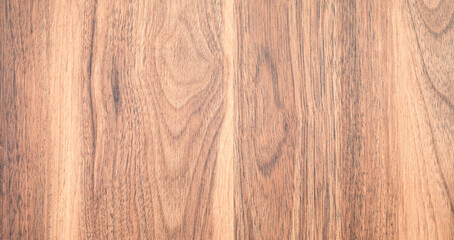 Naklejka premium Close-up of smooth wooden planks. Light brown tones blend naturally. Subtle grain patterns flow across the surface. Ideal for home decor backgrounds. Perfect for interior design projects