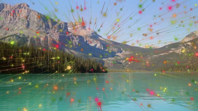 Particle burst emerging at center and radiating into streaks over turquoise lake, creating overlay