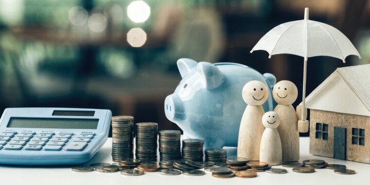 Financial planning concept with calculator, piggy bank, wooden family figures, house model, umbrella, and stacked coins for savings and protection